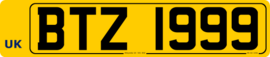 A Belfast plate displaying the optional EU format "UK" country code. Any other format displaying a side badge, including those bearing the codes "NI" or "IRL", are unofficial. Northern Ireland Rear Registration Plate (Blank identification band).png