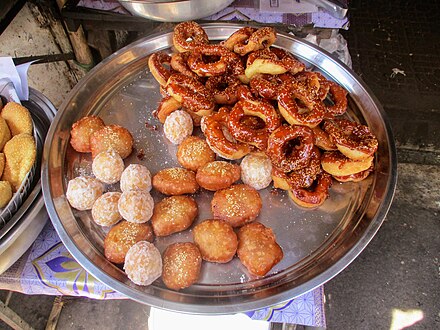 Egg cakes (num pong), sesame balls (num kroch), and Cambodian doughnuts (num kong)