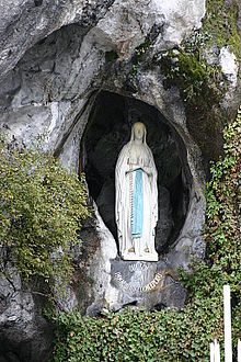 Our Lady of Lourdes appearing at Lourdes with rosary beads