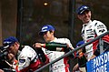 Overall winners Tom Kristensen, Seiji Ara & Rinaldo Capello on the podium at the 2004 Le Mans (50884454812).jpg