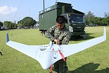 A marine UAV operator with the MAG Super Swiper II UAV, which is part of the Marine Forces Imaging & Targeting Support System (MITSS) of the Philippine Marines. PMCSuperSwiperIIMITSS1.jpg