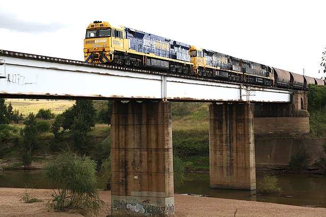Pacific National 92 class locomotives hauling a coal train over the Hunter River at Singleton