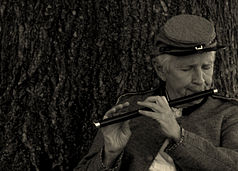 Reenactor plays the fife at The Angle at Gettysburg, Pennsylvania. Playing the fife at The Angle.jpg