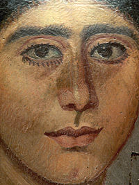 Mummy portrait in encaustic from Antinoopolis. The woman's hairstyle recalls portraits of Sabina, wife of the emperor Hadrian. 2nd Century. Louvre collection.