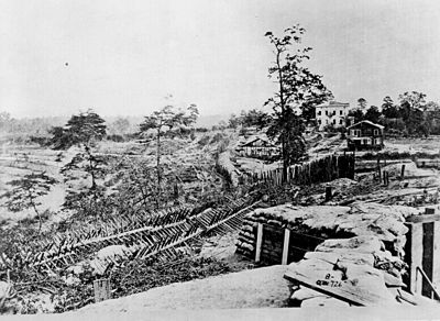 Palisades and chevaux de frise in front of the Ponder House, Atlanta, Georgia, 1864