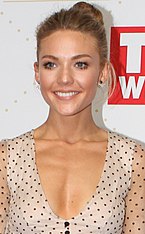 Jasmine Delaney, played by Sam Frost (pictured), is Colby's first love interest. Sam Frost arrives at TV Week Logie Awards 58th Annual Crown (26810371512) (cropped).jpg