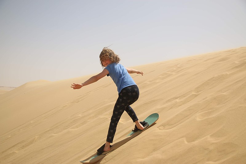File:Sandboarding on the dunes.jpg