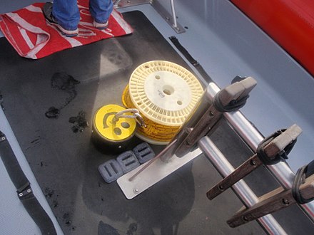 A shot line and reel ready for deployment from a dive boat