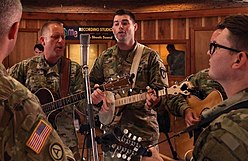 Six-String Soldiers personnel at a 2018 recording session at FAME Studios in Alabama Six-String Soldiers AMC.jpg