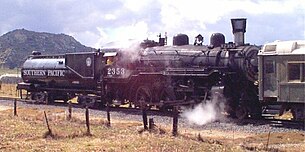 Restored Southern Pacific Lines No. 2353, a 4-6-0 oil-burning steam locomotive built by the Baldwin Locomotive Works in 1912. The cylindrical tender, specifically designed to carry fuel oil, was a signature feature of the railroad. Southern Pacific Lines 4-6-0 No. 2353.JPG