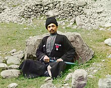 Dagestani man, photographed by Sergey Prokudin-Gorsky, circa 1907 to 1915 Sunni Muslim man wearing traditional dress and headgear.jpg