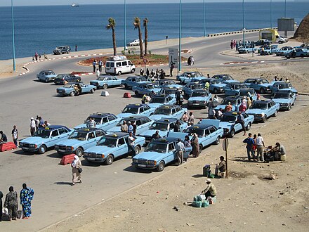 Moroccan taxis at the border with the Spanish exclave of Ceuta