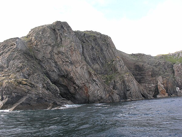 Cliff section through near-vertically dipping ptygmatically folded migmatites