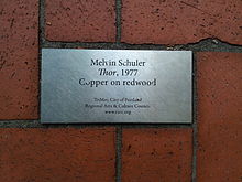 Metal plaque set in brick pavers