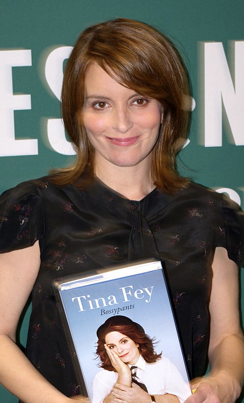 Fey holding a copy of Bossypants, published in April 2011