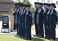 U.S. Airmen stand at parade rest as Timothy Hale, background left, cabinet secretary of the New Mexico Department of Veterans' Services, gives a speech during the POW-MIA recognition ceremony at Heritage 120921-F-FJ989-054.jpg