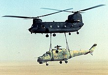 A US Army MH-47 Chinook carrying the Libyan Hind as a slung load, 11 June 1988 US Army 160th SOAR(A) CH-47 sling-load a Mi-24 out of Chad-Operation Mount Hope III.jpg