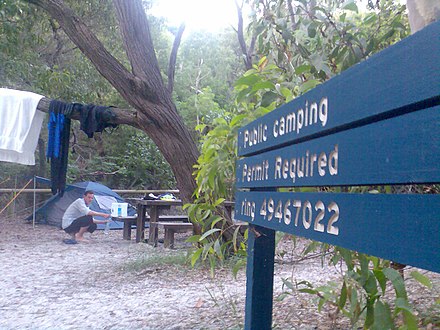 A camper and tent at Whitehaven beach