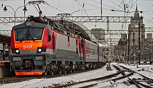 Dual-voltage six-axle electric locomotive EP20-020 with passenger train departs from the Kiyevskaya railway station