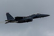 An F-15E Strike Eagle, tail number 91-0313, taking off from RAF Lakenheath in England. The aircraft is assigned to the 494th Fighter Squadron.