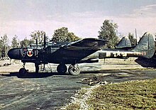 A P-61A of the 425th NFS (RAF Scorton, England) 425th Night Fighter Squadron P-61 Black Widow 42-5569 with D-Day invasion stripes.jpg