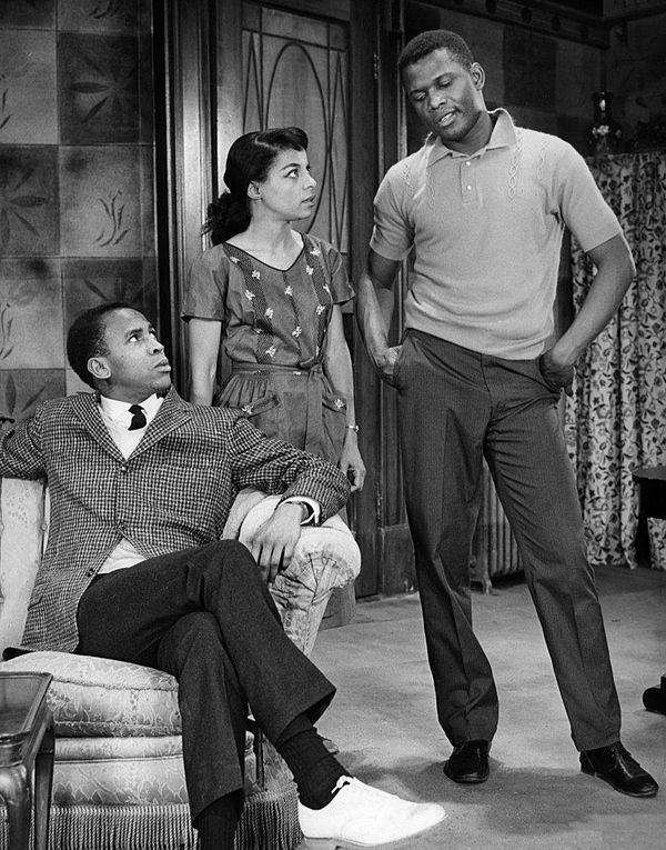 A scene from the play A Raisin in the Sun in 1959, with (from left) Louis Gossett Jr. as George Murchison, Ruby Dee as Ruth Younger, and Poitier as Wa