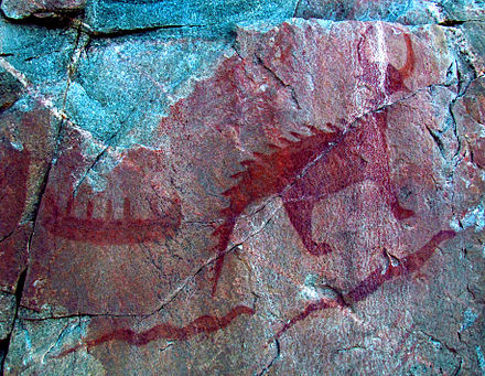 Pictograph of a canoe (top left), Mishipeshu (top right), and two giant serpents (chignebikoogs), panel VIII, Agawa Rock, Lake Superior Provincial Park, Ontario, Canada