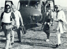 Armed Department of State security agents accompany U.S. Ambassador Deane Hinton in El Salvador in the early 1980s. Armed Department of State security agents accompany U.S. Ambassador Deane Hinton in El Salvador circa 1982.png