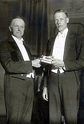 President Calvin Coolidge presents Lindbergh with a Hubbard Medal, 1928