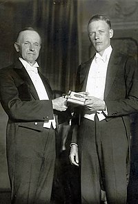 Charles Lindbergh receives his medal from President Calvin Coolidge CoolidgeLindbergh.jpg