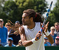 Dustin Brown competing in the second round of the 2015 Wimbledon Qualifying Tournament at the Bank of England Sports Grounds in Roehampton, England. The winners of three rounds of competition qualify for the main draw of Wimbledon the following week.