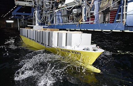 Container ship model undergoing testing.