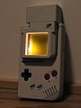 A add on lamp such as this, or a carefully placed flashlight, was required to play the GameBoy in the dark.