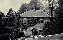 George Meredith and family members, photographed in the rear garden of Flint Cottage, Box Hill.