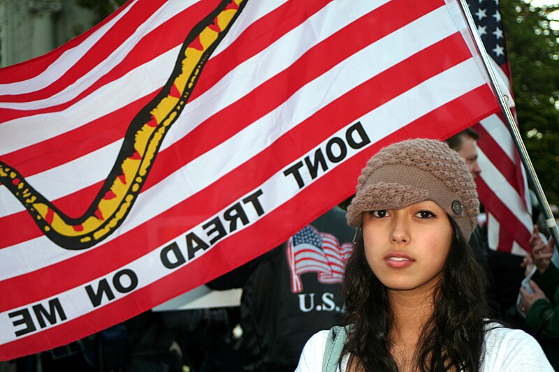 File:Girl in front of flag.jpg