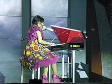 Gutawa playing the piano in the Kotak Musik Gita Gutawa concert, 2008 Gita Gutawa in concert 4.jpg