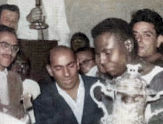 Egypt's captain Hanafy Bastan carrying the African Cup of Nations trophy in 1957