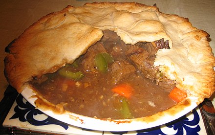 Homemade meat pie with beef and vegetables.