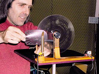 Jacques Dudon playing photosonic disk Jacques Dudon&disk.jpg