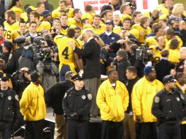 Cal running back Jahvid Best (no. 4) accepts the 2008 Emerald Bowl Offensive MVP trophy from Emerald Bowl Executive Director Gary Cavalli