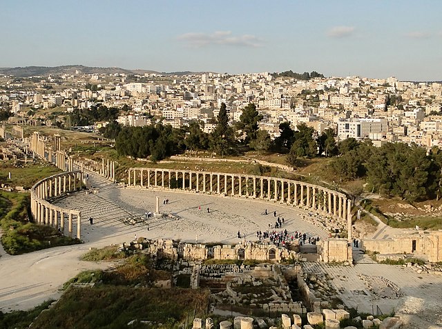The Oval Forum of Jerash (c. 1st century AD), then member of the ten-city Greco-Roman league, the Decapolis, seven of which are present in modern-day 