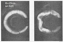 An early photograph of the kink instability in a toroidal pinch - the 3 by 25 pyrex tube at Aldermaston. Kink instability at Aldermaston.jpg