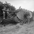 Officers inspect a German Mk IV tank knocked out by the Durham Light Infantry - 11 June 1944