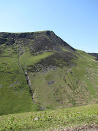 View showing the crags below the summit and the former mine workings in the Glenderaterra valley . Lonscale Fell from Glenderaterra Beck.jpg