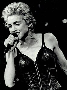 Madonna (pictured in 1987) served as an inspiration for album, who later approved her song "Into the Groove" for a mash-up treatment. Madonna in concert wearing fishnets 1987 (cropped).jpg