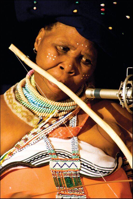 Madosini playing the umrubhe mouth bow.