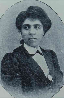Black and white photograph of a young Armenian woman from the chest up. She faces the camera but looks to her right, away from the viewer.