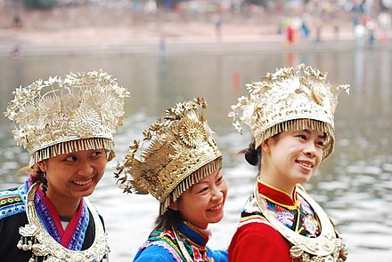 Miao girls from Guizhou wearing traditional silver jewelry headdresses