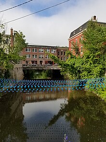 Building of the State street built on the North Branch River (tributary of Winooski River). Montpelier, Vermont- Building on the river crossing State street-2018-07-28.jpg
