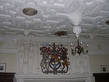 King James VI's arms and plasterwork in the great hall at Muchalls Castle Muchallsovermantle.jpg